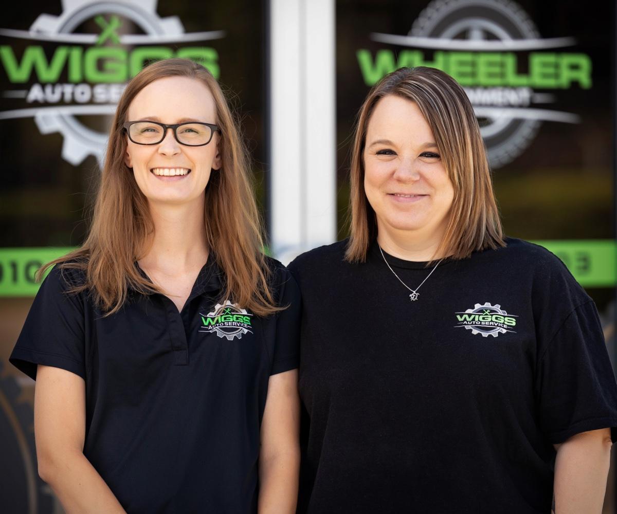 Two Wiggs Auto Service team members photographed outside their shop