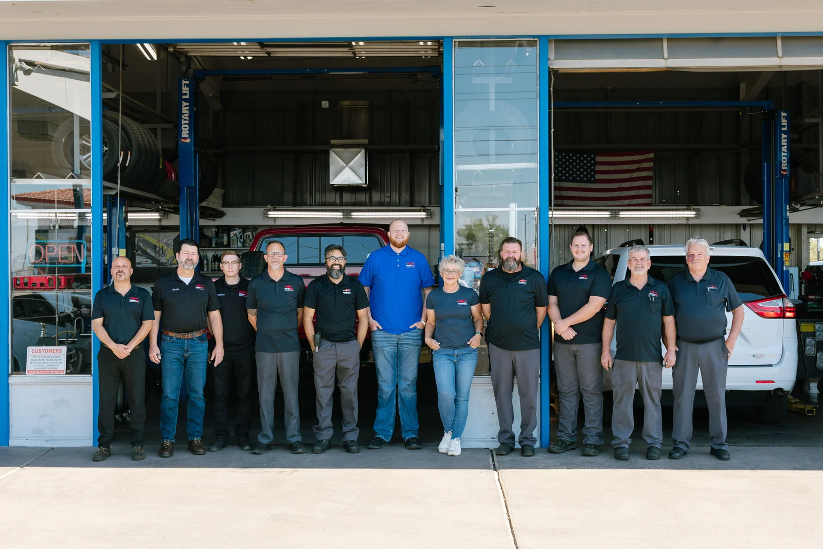 The Thunderbird Automotive Specialists team standing in front of their service bays